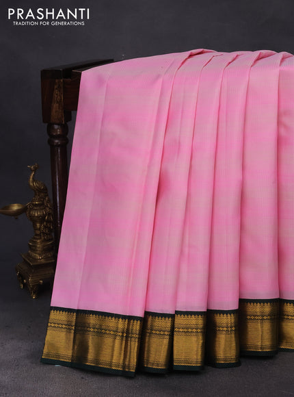 Pure kanchipuram silk saree candy pink and bottle green with allover zari stripe pattern and zari woven korvai border