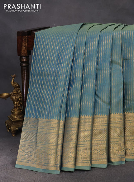 Pure kanchipuram silk saree dual shade of pastel green and pink with allover zari stripe weaves and long zari woven border