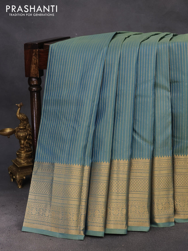 Pure kanchipuram silk saree dual shade of pastel green and pink with allover zari stripe weaves and long zari woven border