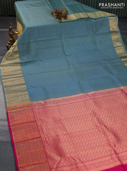 Pure kanchipuram silk saree dual shade of pastel green and pink with allover zari stripe weaves and long zari woven border