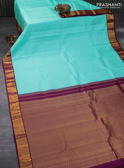 Pure kanchipuram silk saree teal blue and wine shade with zari woven buttas and zari woven korvai border