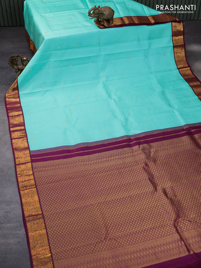 Pure kanchipuram silk saree teal blue and wine shade with zari woven buttas and zari woven korvai border