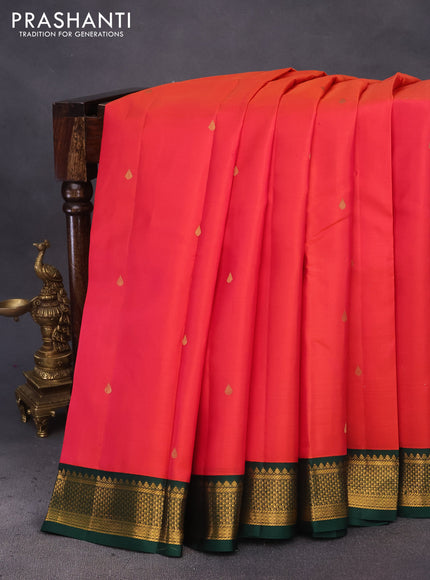 Pure kanchipuram silk saree dual shade of pinkish orange and bottle green with zari woven buttas and zari woven korvai border