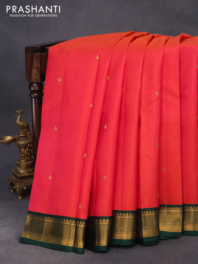 Pure kanchipuram silk saree dual shade of pinkish orange and bottle green with zari woven buttas and zari woven korvai border