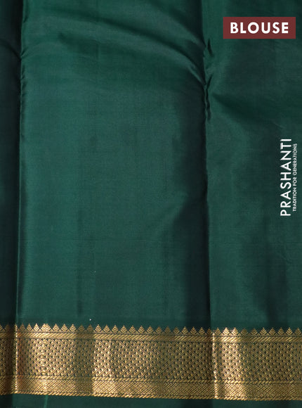 Pure kanchipuram silk saree dual shade of pinkish orange and bottle green with zari woven buttas and zari woven korvai border