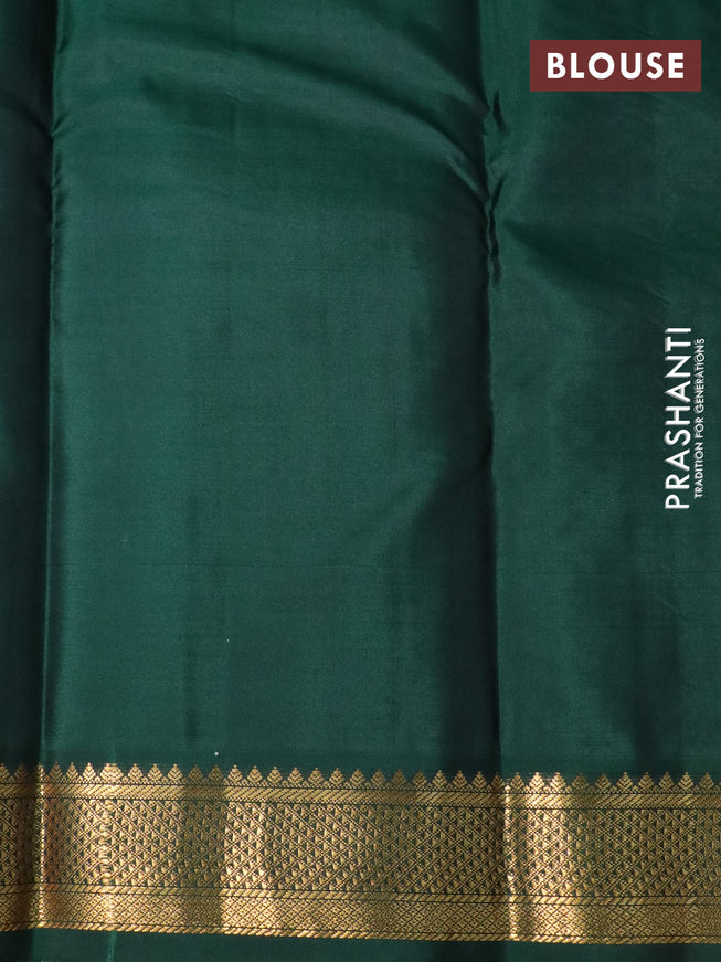 Pure kanchipuram silk saree dual shade of pinkish orange and bottle green with zari woven buttas and zari woven korvai border