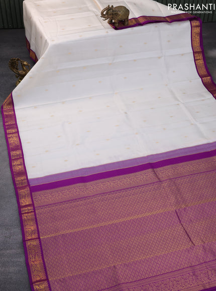 Pure kanchipuram silk saree off white and purple with zari woven buttas and zari woven korvai border