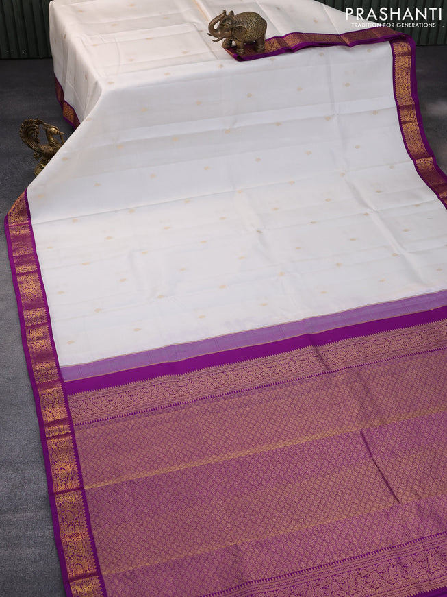 Pure kanchipuram silk saree off white and purple with zari woven buttas and zari woven korvai border