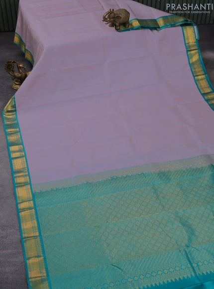 Pure kanchipuram silk saree pastel lavender shade and teal blue with zari woven buttas and zari woven korvai border