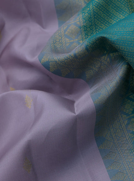 Pure kanchipuram silk saree pastel lavender shade and teal blue with zari woven buttas and zari woven korvai border