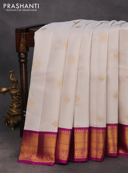 Pure kanchipuram silk saree off white and purple with zari woven buttas and zari woven korvai border