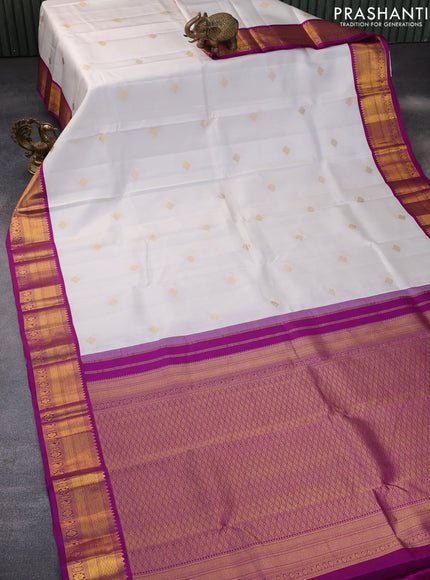 Pure kanchipuram silk saree off white and purple with zari woven buttas and zari woven korvai border