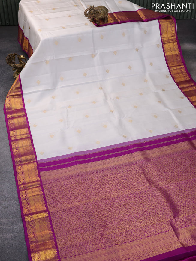 Pure kanchipuram silk saree off white and purple with zari woven buttas and zari woven korvai border