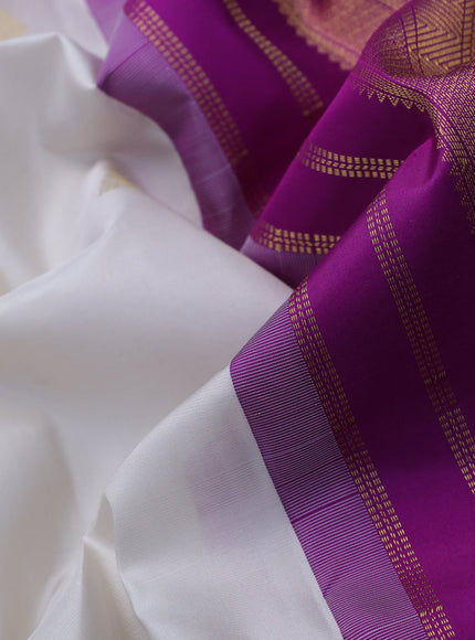 Pure kanchipuram silk saree off white and purple with zari woven buttas and zari woven korvai border