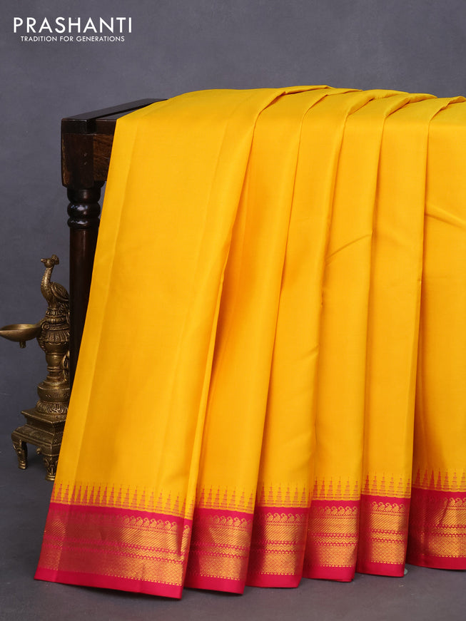 Pure kanchipuram silk saree mango yellow and pink with plain body and temple deisgn zari woven border