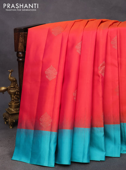 Pure kanchipuram silk saree dual shade of pinkish orange and teal blue with zari woven buttas and simple border