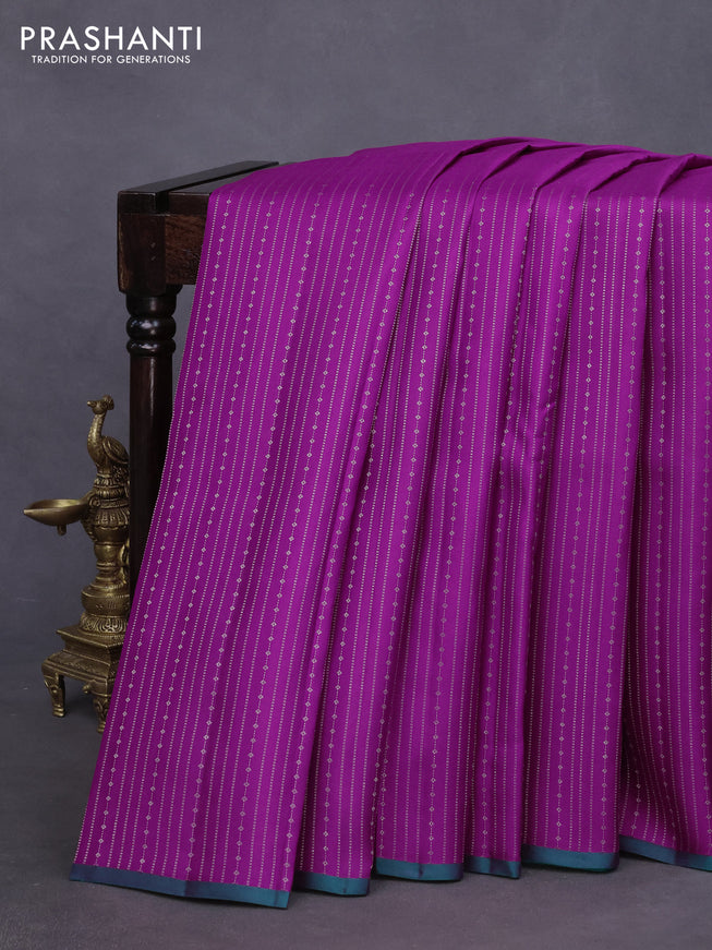 Pure kanchipuram silk saree purple and green with allover zari weaves and piping border