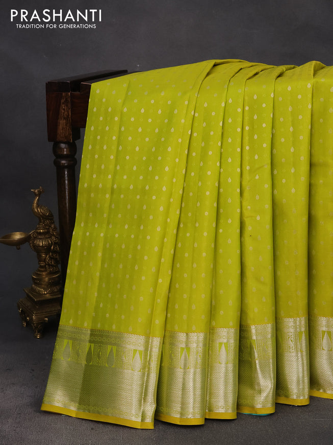 Pure kanchipuram silk saree lime yellow and teal blue with silver zari woven buttas and silver zari woven border