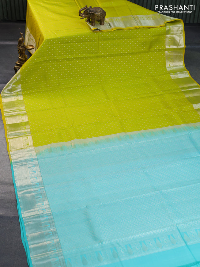 Pure kanchipuram silk saree lime yellow and teal blue with silver zari woven buttas and silver zari woven border