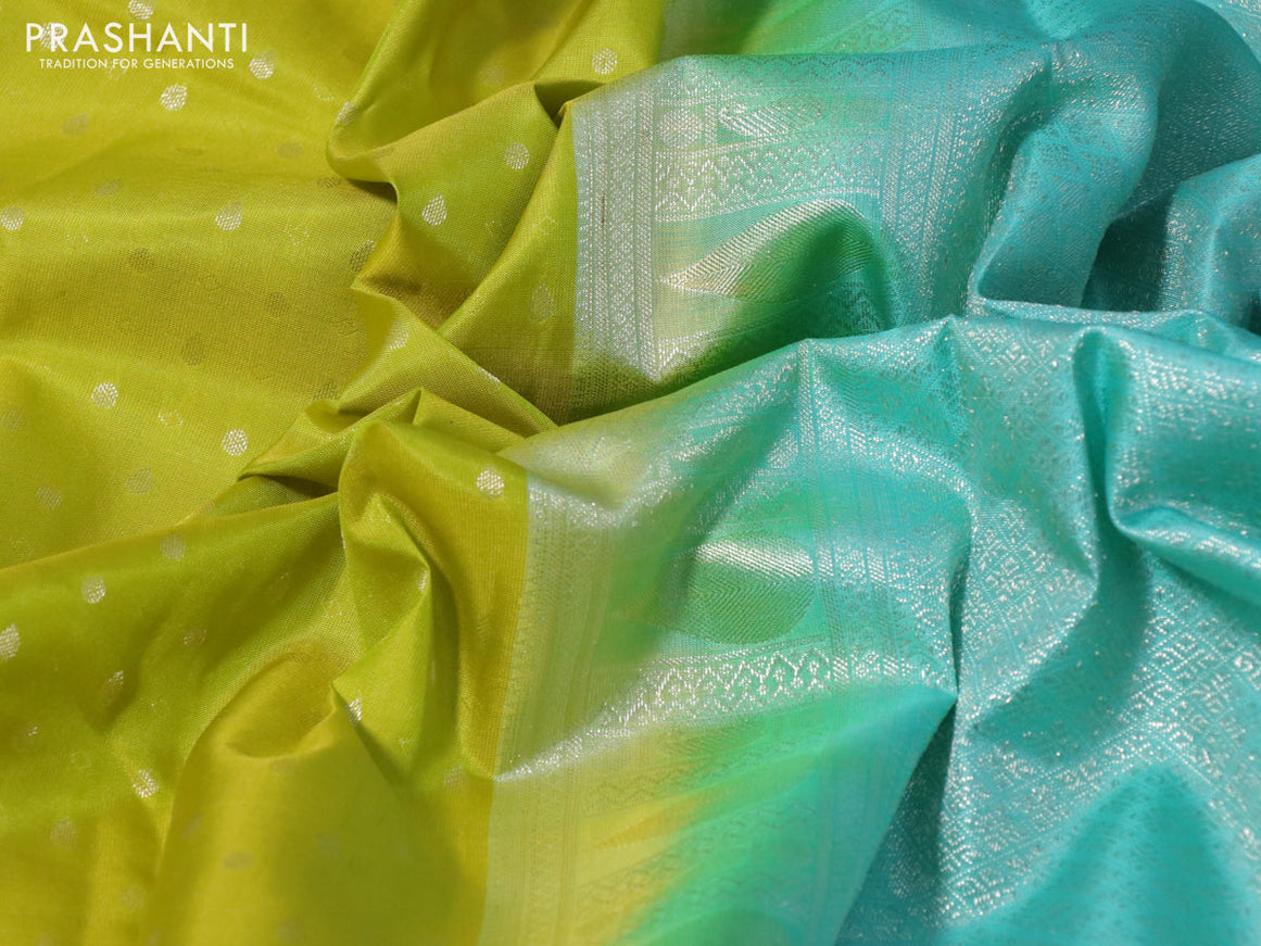 Pure kanchipuram silk saree lime yellow and teal blue with silver zari woven buttas and silver zari woven border