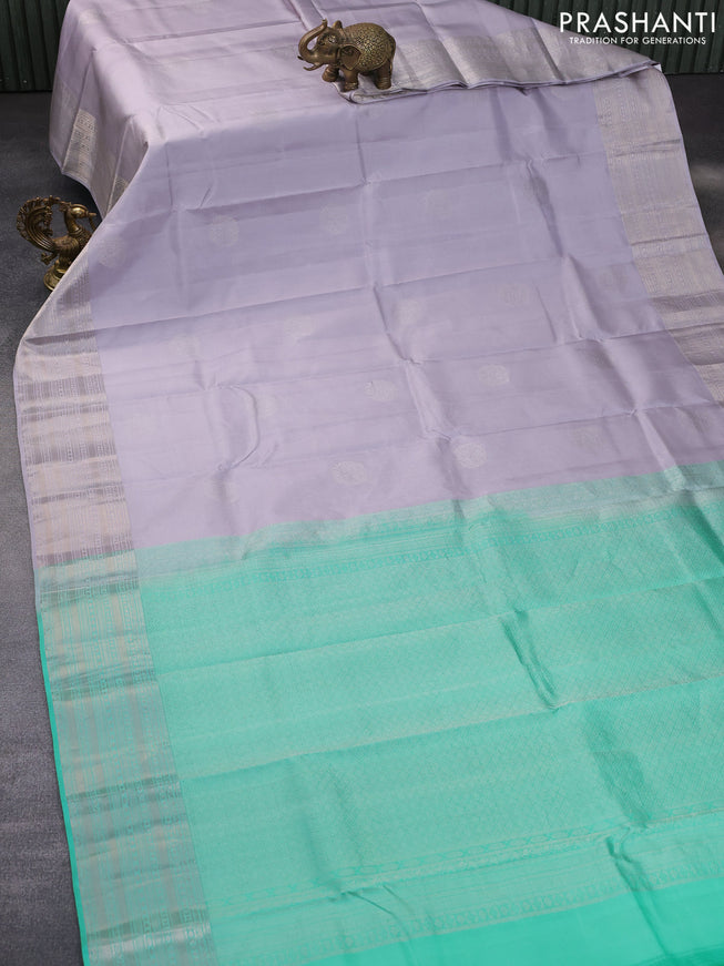 Pure kanchipuram silk saree pastel lavender shade and teal green with silver zari woven buttas and silver zari woven border