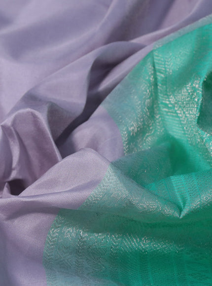 Pure kanchipuram silk saree pastel lavender shade and teal green with silver zari woven buttas and silver zari woven border