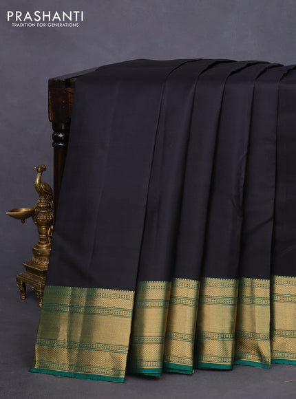 Pure kanchipuram silk saree black and green with plain body and rich zari woven border