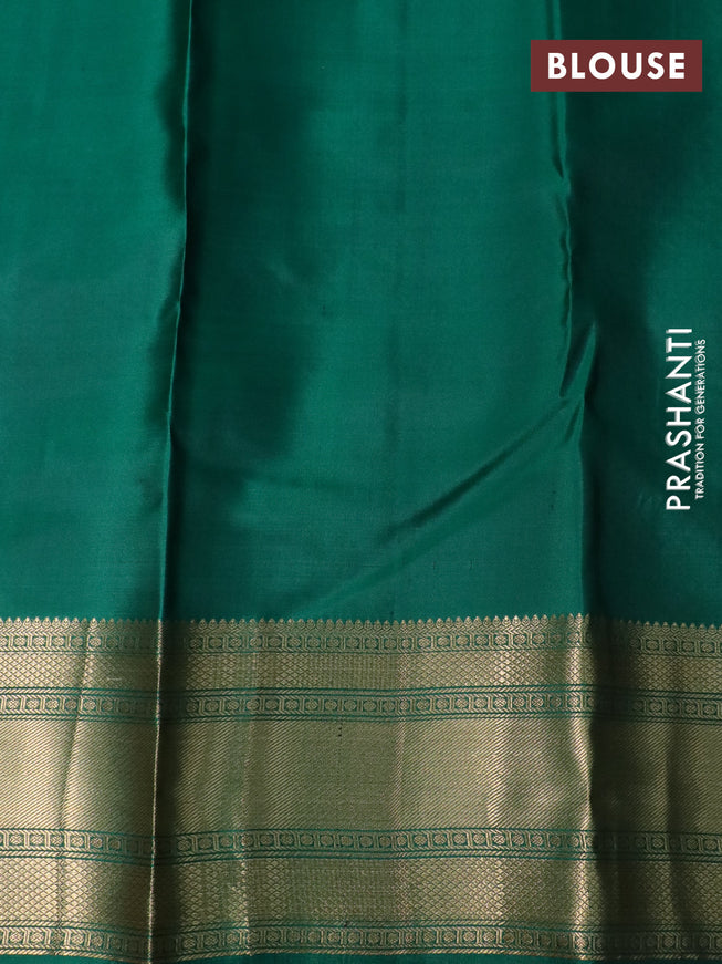 Pure kanchipuram silk saree black and green with plain body and rich zari woven border