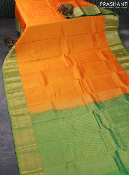 Pure kanchipuram silk saree dual shade of orange and green with plain body and rich zari woven border