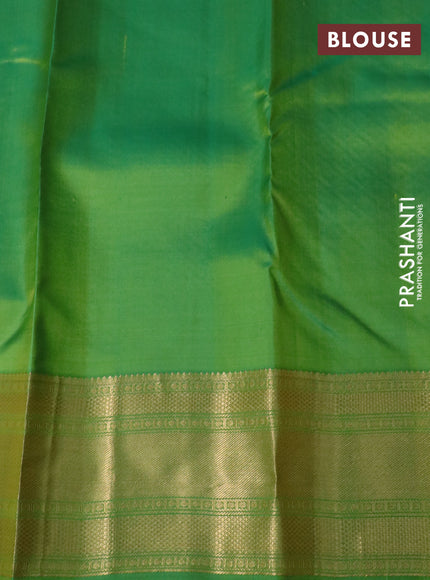 Pure kanchipuram silk saree dual shade of orange and green with plain body and rich zari woven border