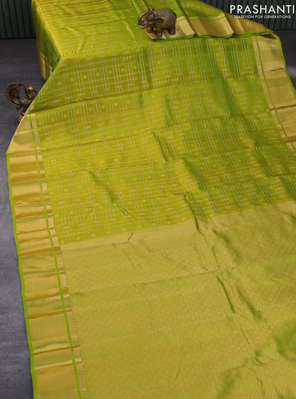 Pure kanchipuram silk saree light green with allover zari checks & buttas and rich zari woven border