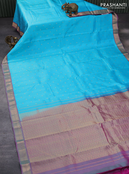 Pure kanchipuram silk saree light blue and dual shade of magenta pink with allover zari woven buttas and zari woven border