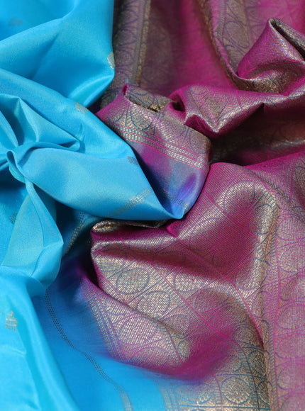 Pure kanchipuram silk saree light blue and dual shade of magenta pink with allover zari woven buttas and zari woven border