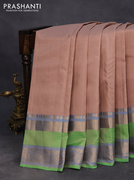 Pure kanchipuram silk saree beige and light green with allover zari weaves and long rich zari woven border