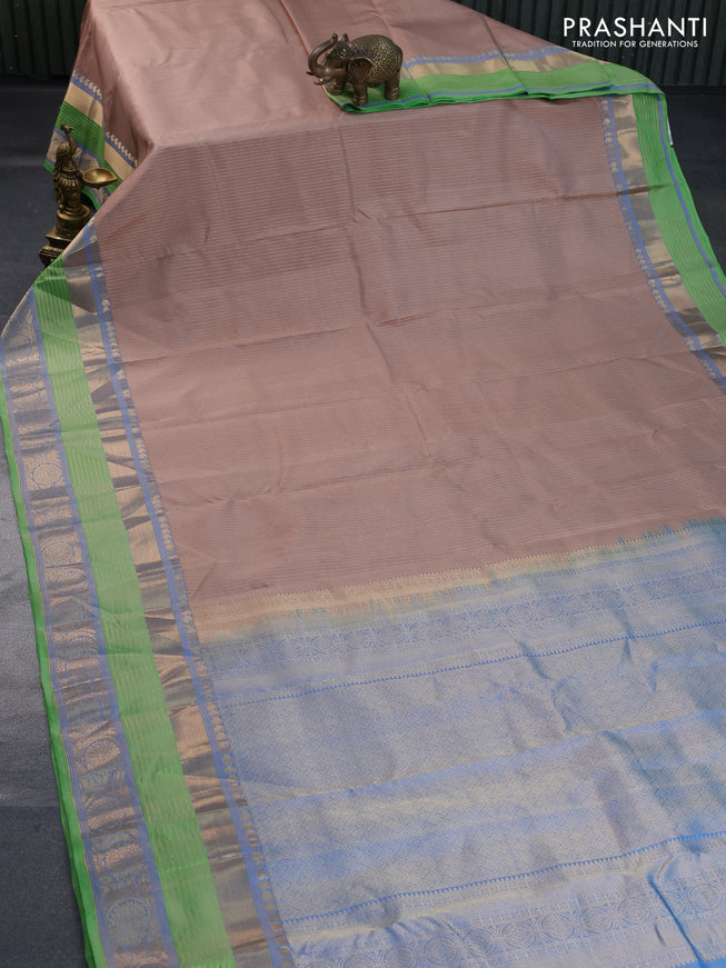 Pure kanchipuram silk saree beige and light green with allover zari weaves and long rich zari woven border