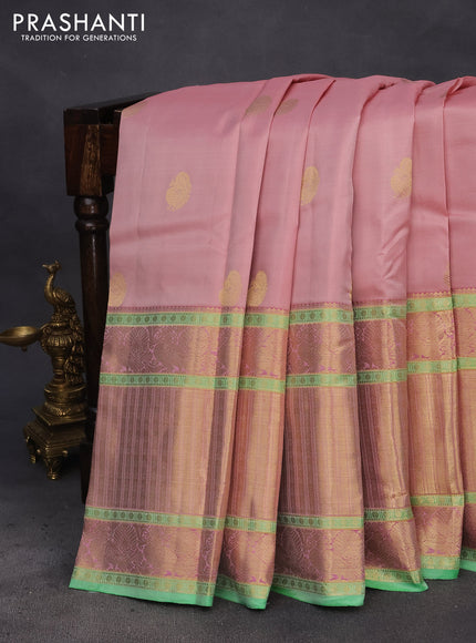 Pure kanchipuram silk saree mild peach and green with annam zari woven buttas and long annam zari woven border