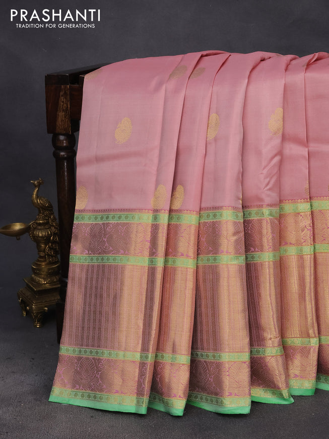 Pure kanchipuram silk saree mild peach and green with annam zari woven buttas and long annam zari woven border