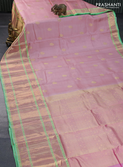 Pure kanchipuram silk saree mild peach and green with annam zari woven buttas and long annam zari woven border