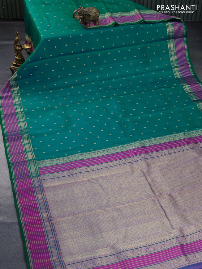 Pure kanchipuram silk saree dual shade of teal bluish green and pink with allover zari woven buttas and rich zari woven border