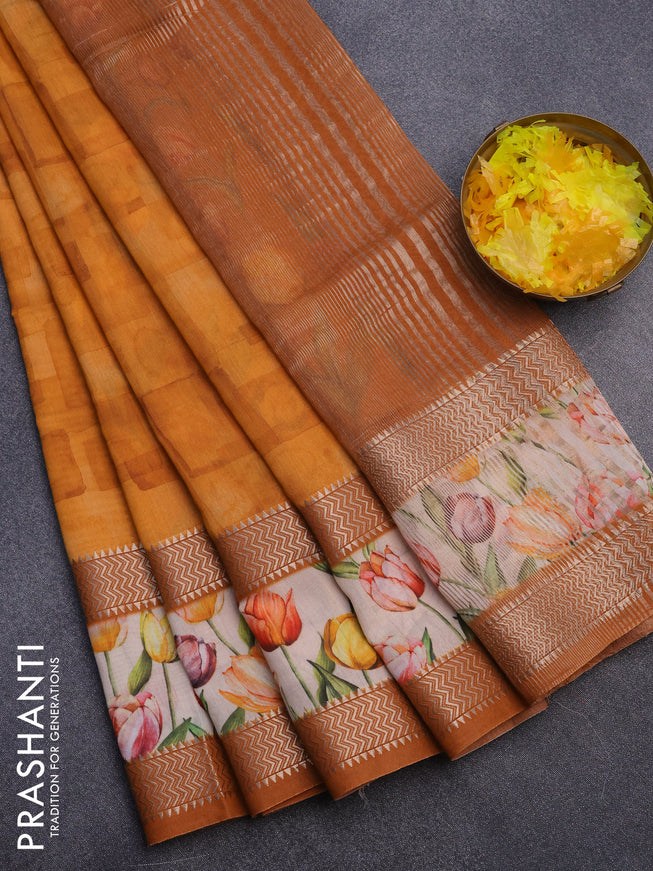 Muslin silk saree orange and cream with allover prints and rettapet zari woven floral printed border