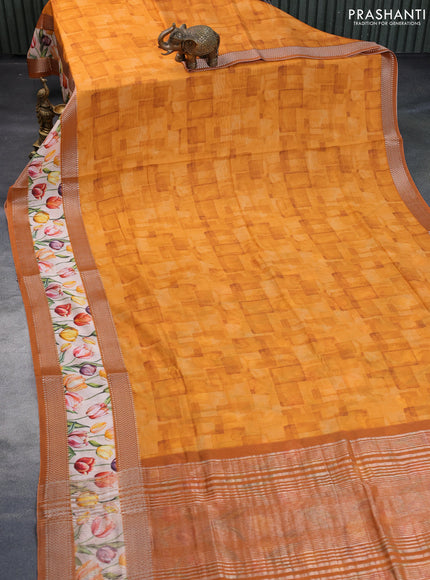 Muslin silk saree orange and cream with allover prints and rettapet zari woven floral printed border