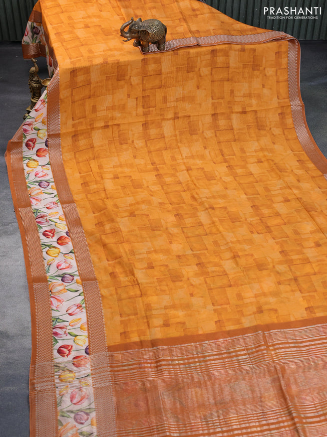 Muslin silk saree orange and cream with allover prints and rettapet zari woven floral printed border