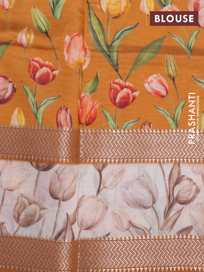 Muslin silk saree orange and cream with allover prints and rettapet zari woven floral printed border