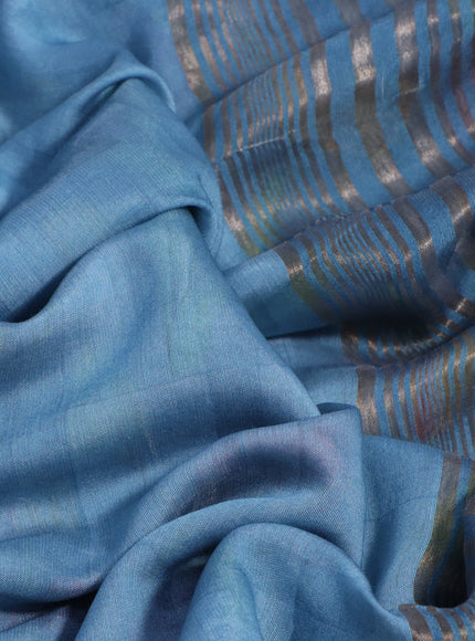 Muslin silk saree light blue shade and cream with allover prints and rettapet zari woven floral printed border