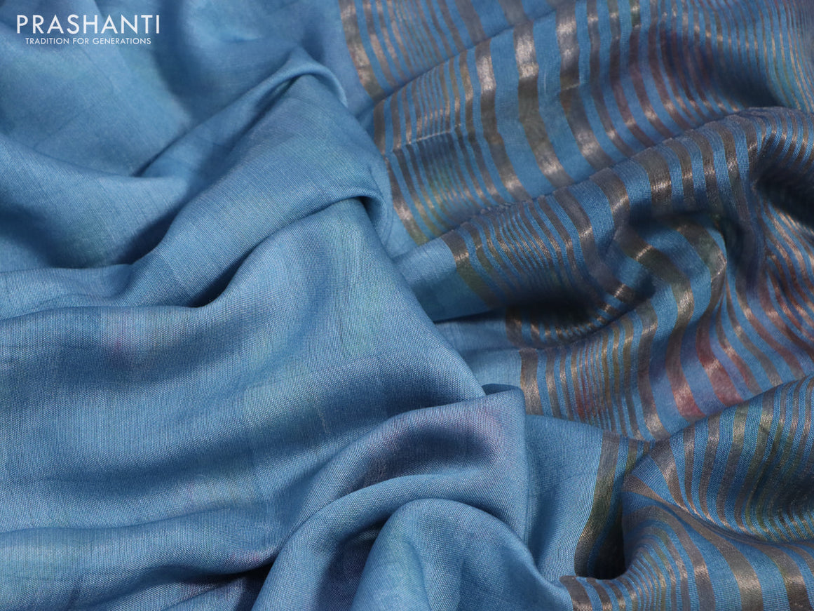 Muslin silk saree light blue shade and cream with allover prints and rettapet zari woven floral printed border