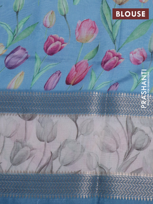 Muslin silk saree light blue shade and cream with allover prints and rettapet zari woven floral printed border