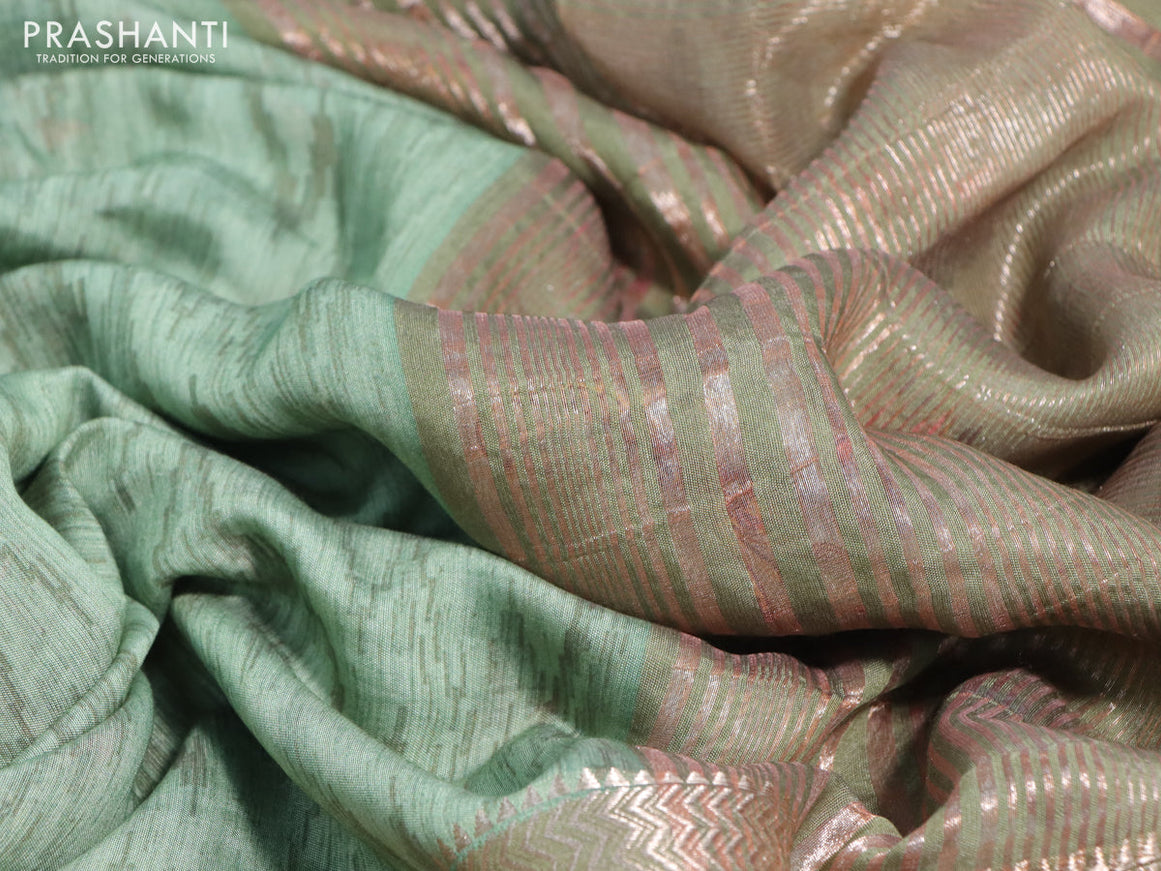 Muslin silk saree pastel green and beige with allover ikat weaves and rettapet zari woven printed border