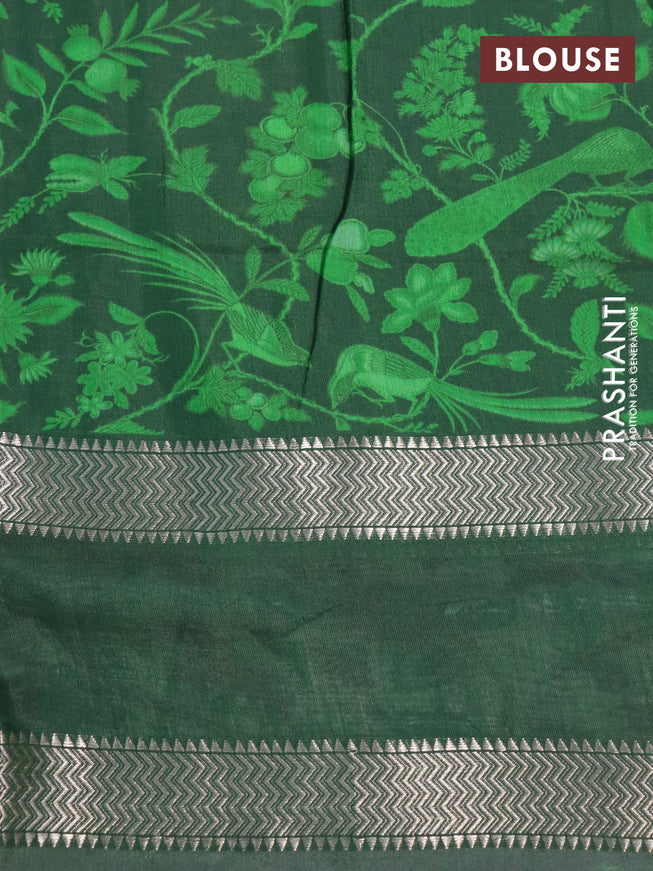 Muslin silk saree green and off white with allover prints and rettapet zari woven printed border