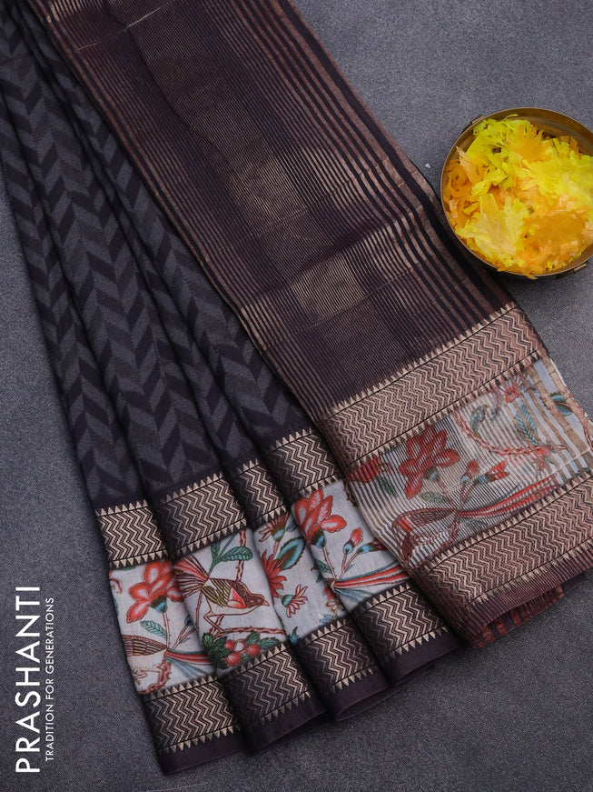 Muslin silk saree black and grey with allover prints and rettapet zari woven printed border