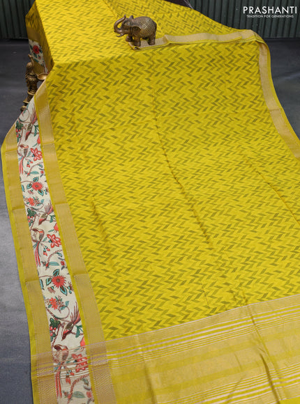 Muslin silk saree yellow and pale yellow with allover prints and rettapet zari woven printed border